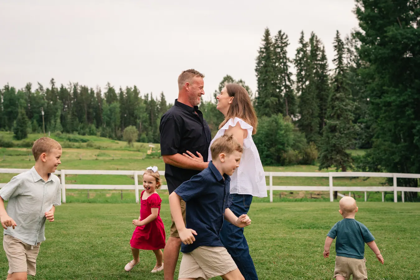 Courtney's family running and playing together on the grass